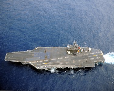 US Navy 110326-N-YZ751-125 Sailors assigned to the supply department of the aircraft carrier USS George H.W. Bush (CVN 77) form the letter E on the