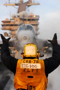 US Navy 110329-N-SB672-196 Aviation Boatswain's Mate (Handling) Ryan Hilliard, from Erie, Pa., directs an EA-6B Prowler