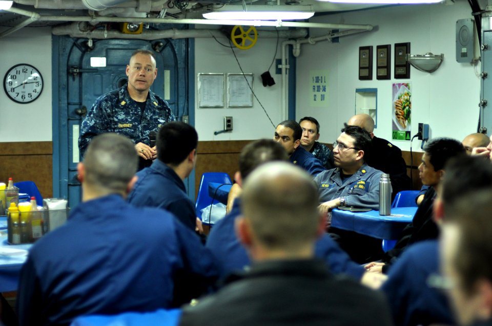 US Navy 110329-N-SF508-120 Master Chief Joseph Fahrney, command master chief of Commander, Task Force 70, speaks to Sailors on the mess decks of th