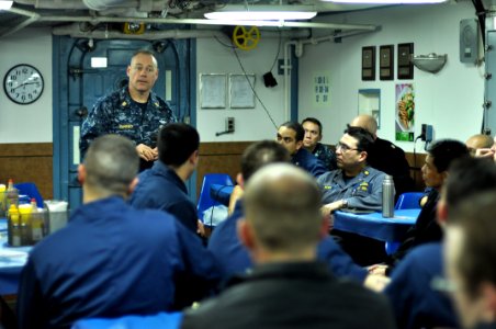 US Navy 110329-N-SF508-120 Master Chief Joseph Fahrney, command master chief of Commander, Task Force 70, speaks to Sailors on the mess decks of th