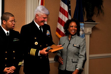 US Navy 110331-N-YR391-005 Capt. Douglas Cochrane, commanding officer of Naval Station Mayport, makes a presentation to Florida Lt. Gov. Jennifer C photo