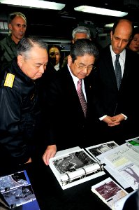 US Navy 110404-N-1004S-325 Adm. Masahiko Sugimoto, left, Japan Defense Minister Toshimi Kitazawa, and United States Ambassador John Roos look at ph