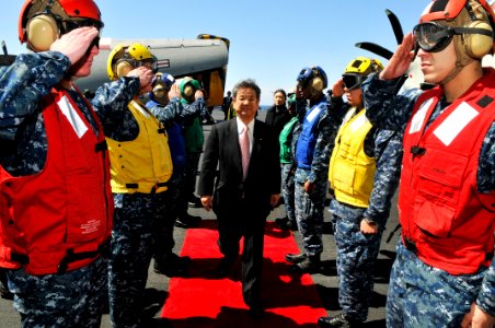 US Navy 110404-N-1004S-046 Japan Defense Minister Toshimi Kitazawa receives honors from Sailors upon his arrival aboard USS Ronald Reagan (CVN 76)