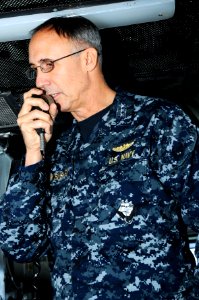 US Navy 110330-N-IC111-027 Vice Adm. Scott Van Buskirk, commander of U.S. 7th Fleet, addresses the crew through the 1MC aboard the aircraft carrier