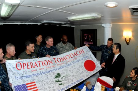 US Navy 110404-N-NB544-326 Senior U.S. Navy, Marine Corps, and Army military service members present Japan Defense Minister Toshimi Kitazawa an Ope