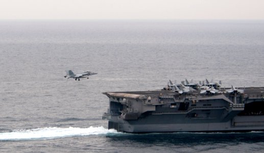 US Navy 110404-N-6505H-308 An F-A-18F Super Hornet approaches USS Carl Vinson (CVN 70)