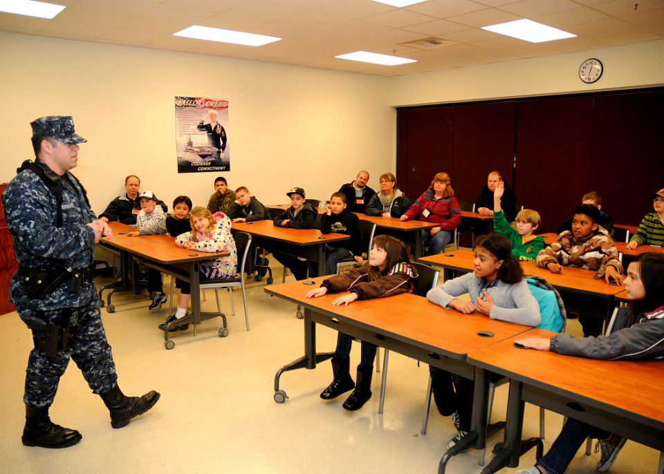 US Navy 110330-N-ZK021-006 Master-at-Arms 2nd Class Cody Abernathy, assigned to Naval Air Station Whidbey Island base security, answers questions f