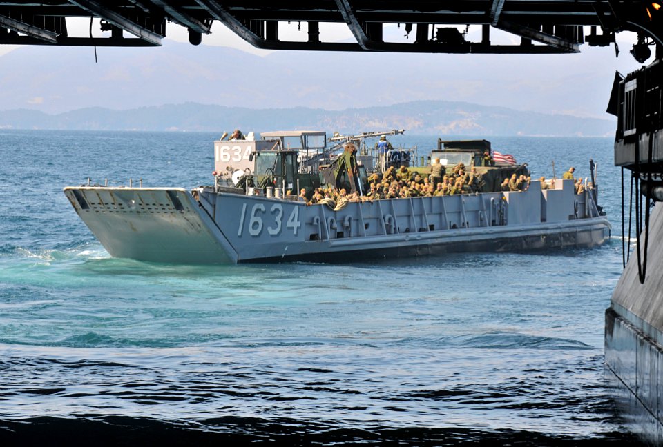 US Navy 110401-N-9950J-172 Marines assigned to the 31st Marine Expeditionary Unit (31st MEU) aboard a landing craft utility, depart the amphibious