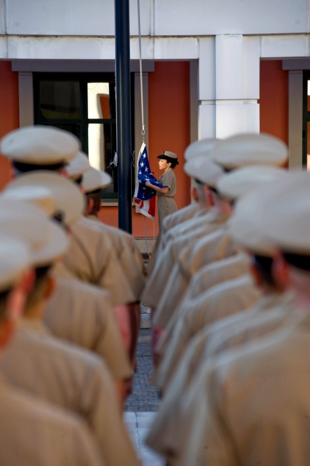 US Navy 110401-N-GT324-123 Senior Chief Legalman Leonette Masters stands by to raise the national ensign during morning colors at Naval Support Act
