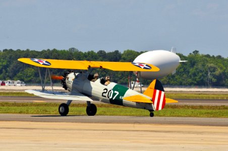 US Navy 110404-N-YR391-002 A vintage Navy biplane lands at Naval Air Station Jacksonville as part of the Centennial of Naval Aviation celebration photo