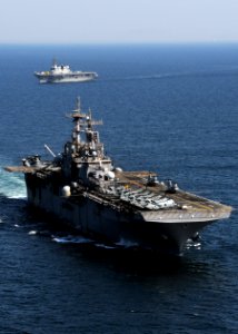 US Navy 110406-N-0120A-001 USS Essex (LHD 2) transits in formation as JS Hyuga (DDH 181) transits in the background