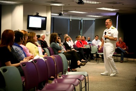 US Navy 110406-N-YM440-213 Rear Adm. Richard C. Vinci, deputy chief of Bureau of Medicine and surgery, speaks to Susan G. Komen Foundation employee