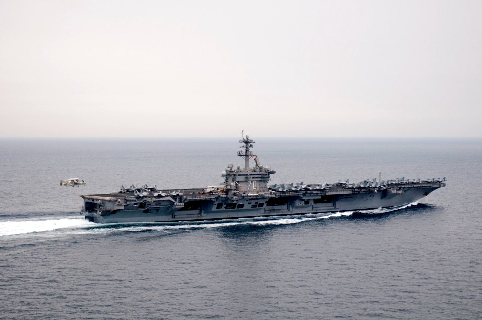 US Navy 110404-N-6505H-511 An E-2C Hawkeye approaches USS Carl Vinson (CVN 70)