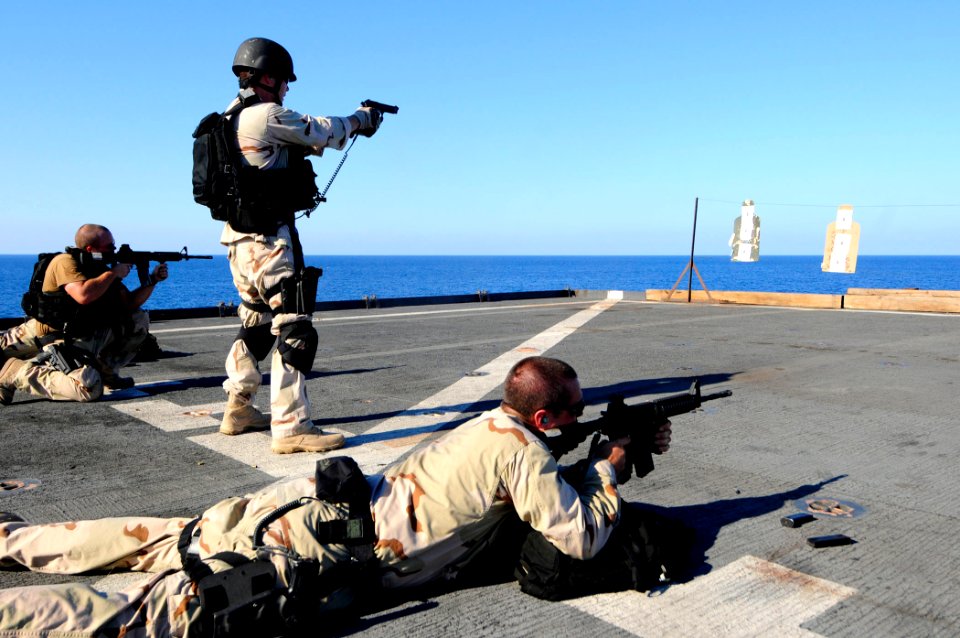 US Navy 110401-N-RC734-443 Sailors participate in a live-fire exercise aboard the amphibious dock landing ship USS Comstock (LSD 45)