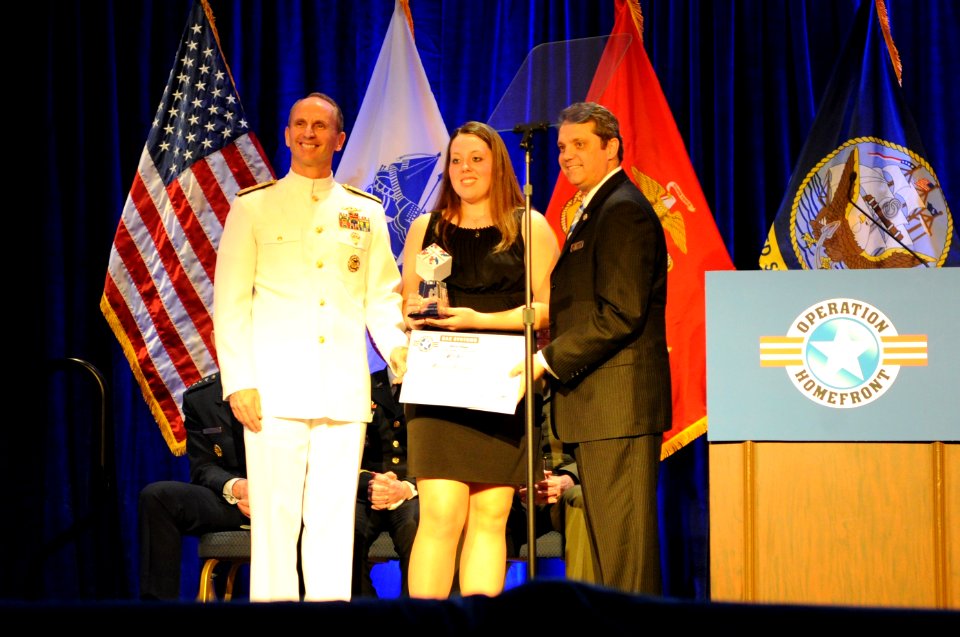 US Navy 110407-N-4930E-523 Vice Chief of Naval Operations Adm. Jonathan W. Greenert presents this year's Navy Military Child of the Year Award to M