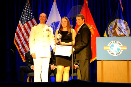 US Navy 110407-N-4930E-523 Vice Chief of Naval Operations Adm. Jonathan W. Greenert presents this year's Navy Military Child of the Year Award to M