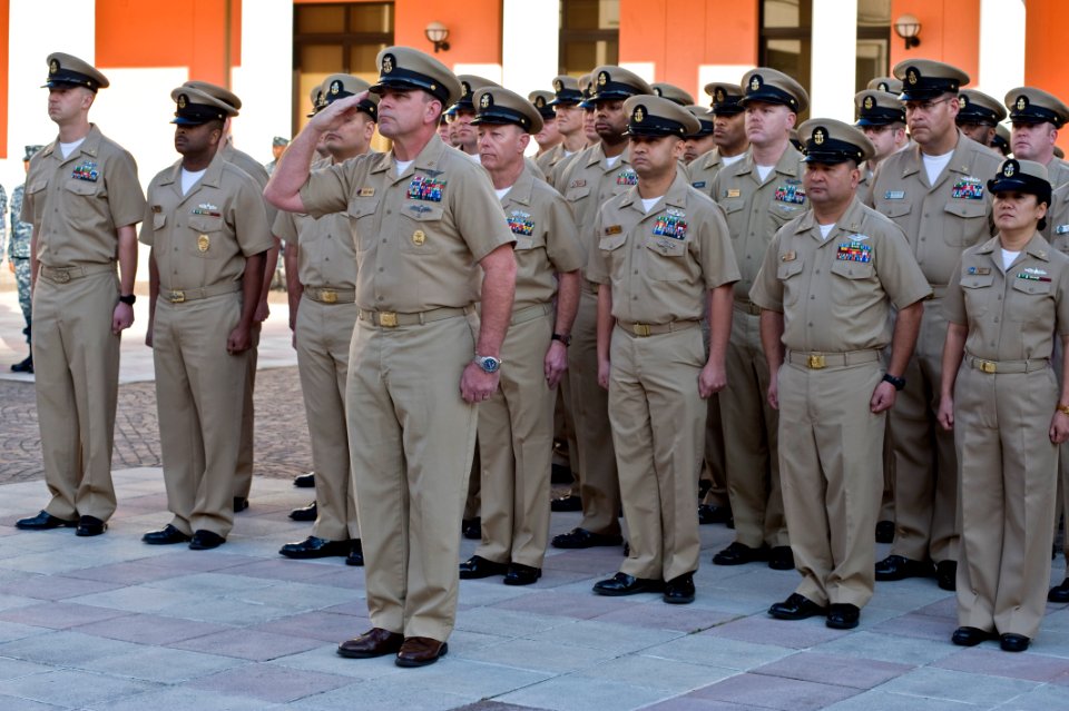US Navy 110401-N-GT324-134 Command Master Chief Robert White, assigned to Commander Navy Region Europe, Africa, and Southwest Asia, salutes the nat