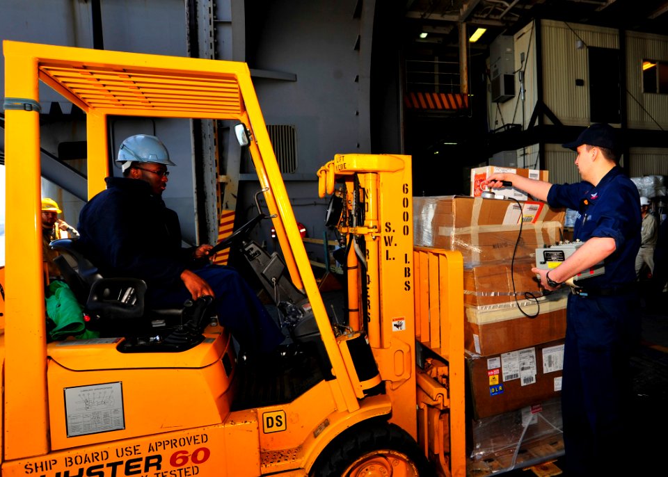 US Navy 110405-N-MH885-029 Machinist's Mate 2nd Class Chad Glazier scans supplies for radiation aboard USS George Washington (CVN 73)