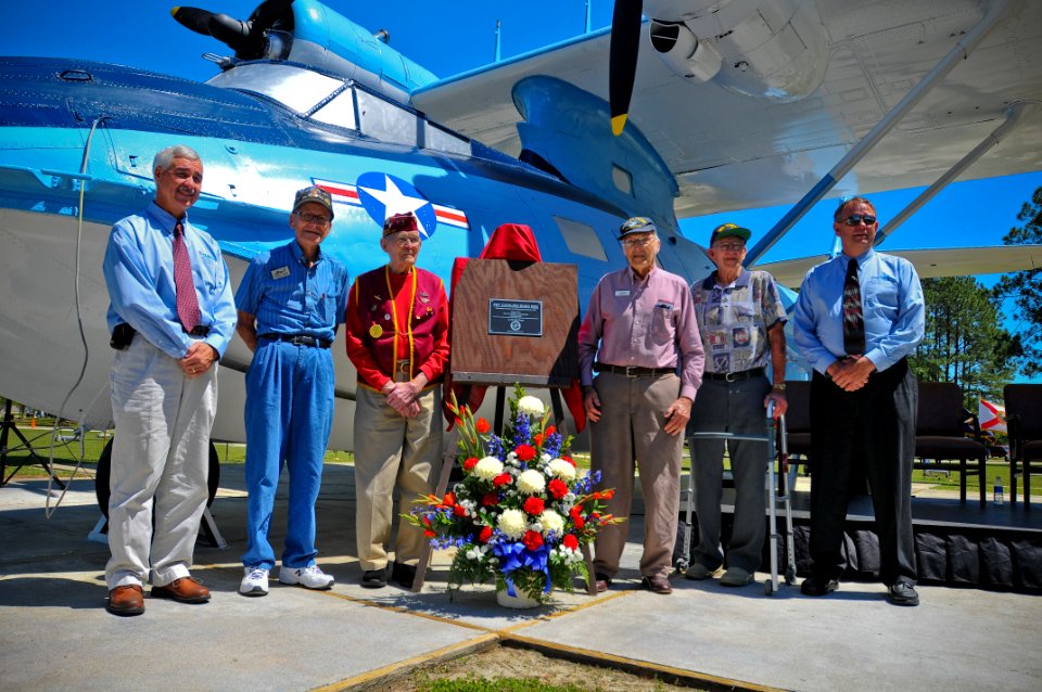 US Navy 110406-N-YR391-008 World War II Navy veterans and their sons pose for a photo during a PBY-5A BUNO 6582 dedication at Naval Air Station Jac