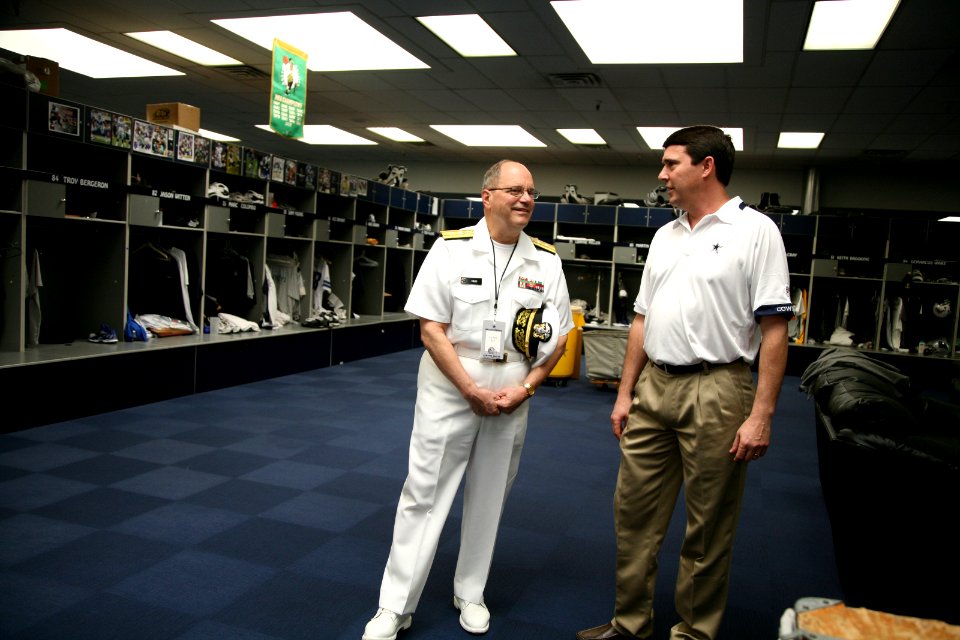 US Navy 110405-N-YM440-034 Rear Adm. Richard C. Vinci tours the Dallas Cowboys facility with head trainer Jim Maurer during Dallas Fort Worth Navy