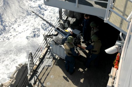 US Navy 110404-N-NL541-018 Sailors fire an MK 38 25 mm mounted gun during a practice fire aboard USS Boone (FFG 28)