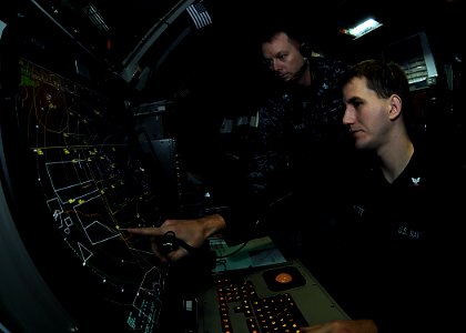 US Navy 110406-N-2908M-009 ir-traffic Controller 1st Class Christopher Sweet and Air-traffic Controller 3rd Class Michael Ravellette track aircraft