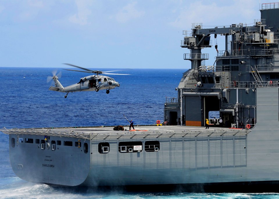 US Navy 110408-F-HS649-138 An MH-60S Sea Hawk helicopter prepares to transport supplies from the Military Sealift Command dry cargo and ammunition