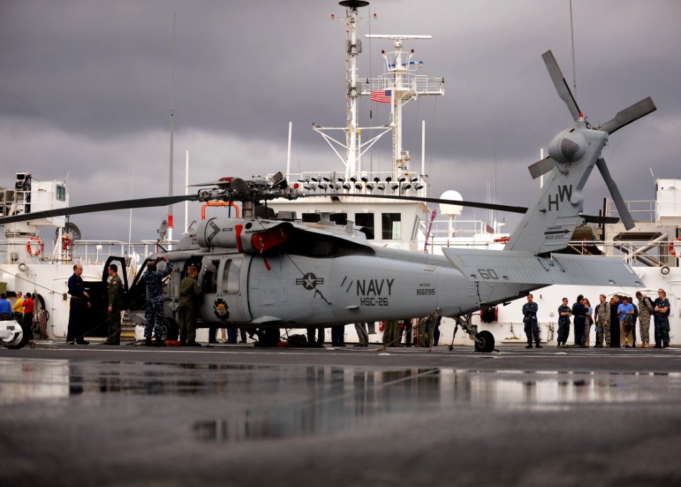 US Navy 110409-N-NY820-057 Navy and Air Force service members and non-government organization workers are trained for flight operations in an MH-60