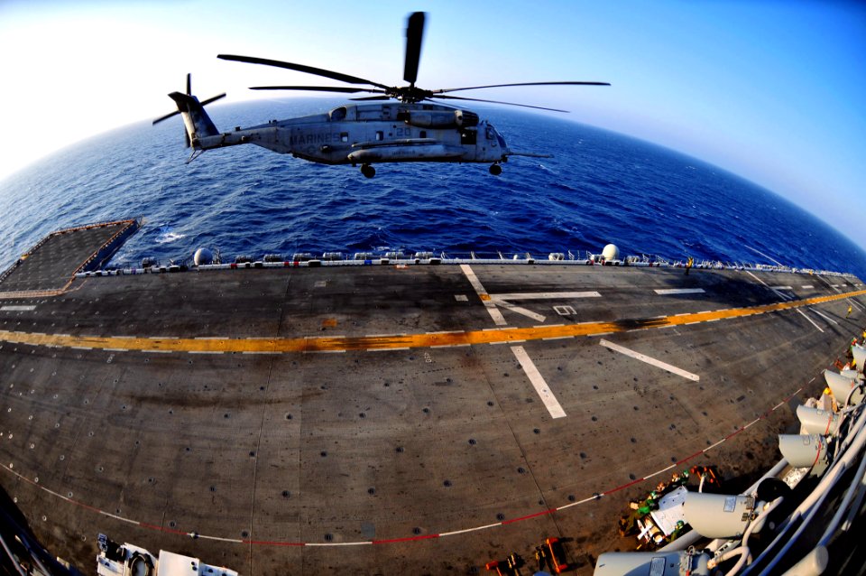 US Navy 110405-N-ZS026-252 A CH-53 Sea Stallion helicopter assigned to the Evil Eyes of Marine Medium Squadron (HMM) 163 takes off from the amphibi