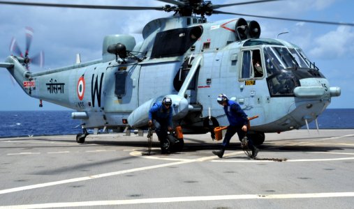 US Navy 110407-N-0864H-502 Sailors aboard USS Blue Ridge (LCC 19) remove the chains that secured an Indian MK42 Sea Hawk helicopter during exercise