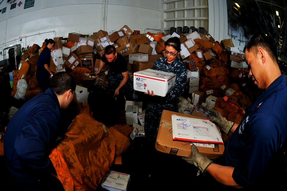 US Navy 110409-N-1004S-858 Sailors sort mail aboard the aircraft carrier USS Ronald Reagan (CVN 76). Ronald Reagan is operating in the western Paci