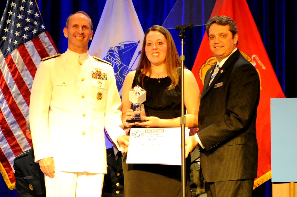 US Navy 110407-N-4930E-525 Vice Chief of Naval Operations Adm. Jonathan W. Greenert presents this year's Navy Military Child of the Year Award to M