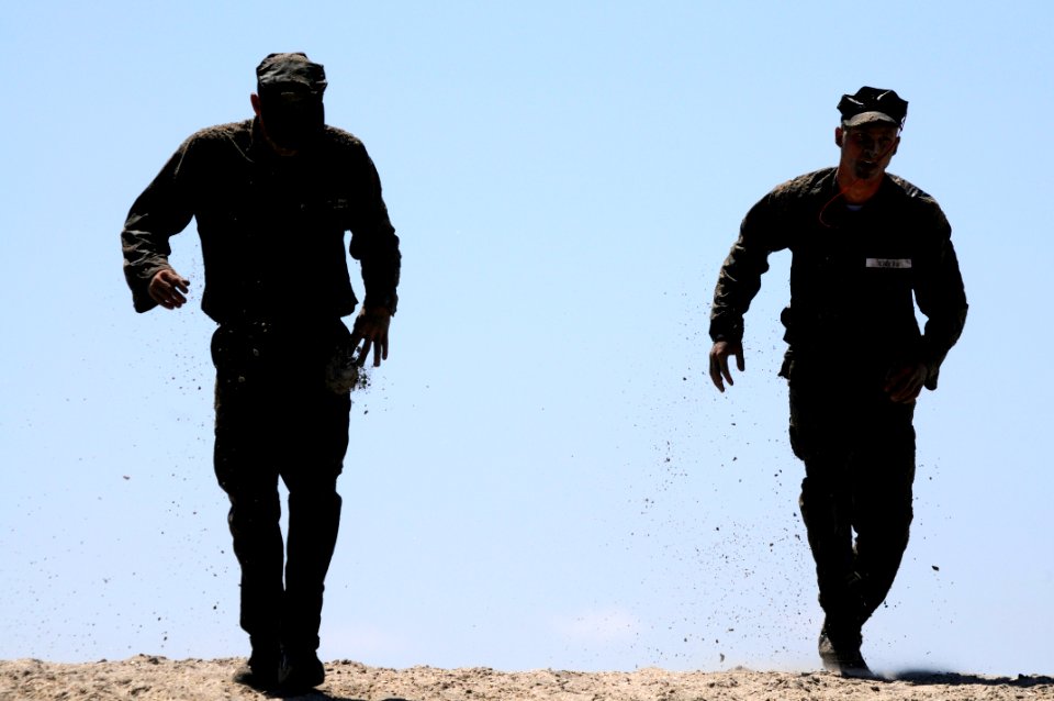 US Navy 110411-N-JR159-070 Students from Basic Underwater Demolition-SEAL (BUD-s) Class 288 participate in log physical training during First Phase