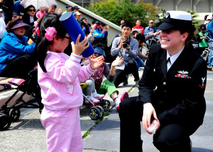 US Navy 110410-N-RO948-059 Musician 3rd Class Danielle Clark interacts with the audience during the 2011 Jinhae International Military Band and Hon