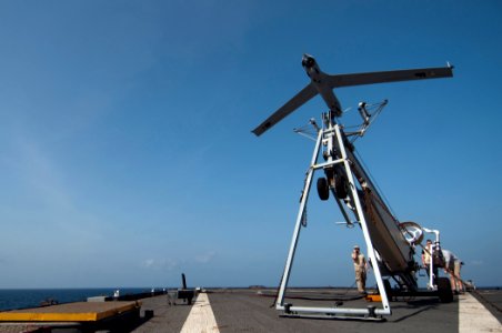 US Navy 110411-N-RC734-058 A Scan Eagle unmanned aerial vehicle (UAV) launches from the flight deck of the amphibious dock landing ship USS Comstoc