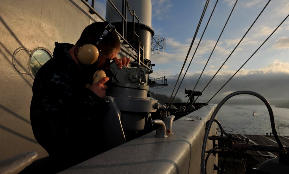 US Navy 110408-N-5031T-066 Quartermaster 3rd Class Joshua Edwards, from Tacoma, Wash., uses an alidade to take bearings aboard the Nimitz-class air