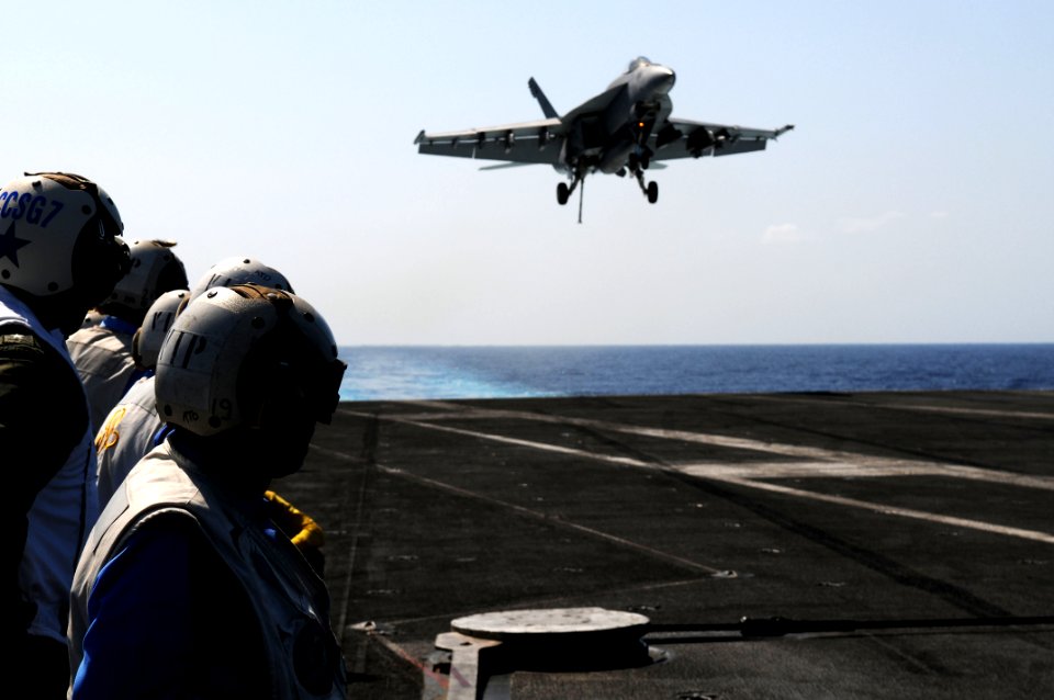US Navy 110408-N-IC111-741 Rear Adm. Robert Girrier, commander of Carrier Strike Group (CSG) 7, observes flight operations aboard the aircraft carr