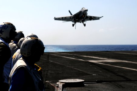 US Navy 110408-N-IC111-741 Rear Adm. Robert Girrier, commander of Carrier Strike Group (CSG) 7, observes flight operations aboard the aircraft carr photo