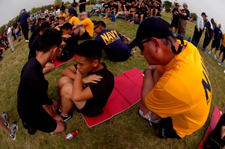 US Navy 110408-N-QP955-010 Staff and students from Navy Recruiting Orientation Unit, in yellow and blue t-shirts, volunteer during the 2011 Navy Ju