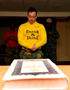 US Navy 110408-N-8288P-014 Sailors aboard USS George Washington (CVN 73) participate in a silent prayer during a Muslim prayer service
