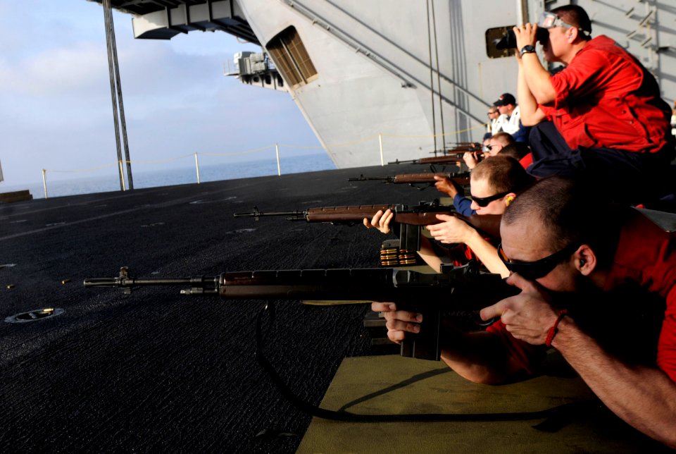 US Navy 110413-N-6320L-044 Sailors fire M14 rifles during a weapons qualification aboard the Nimitz-class aircraft carrier USS Carl Vinson (CVN 70)