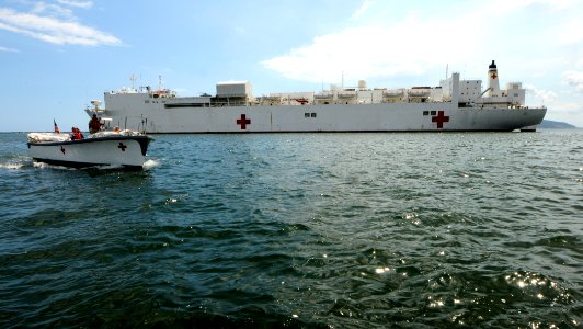 US Navy 110413-N-EP471-283 A launch from the Military Sealift Command hospital ship USNS Comfort (T-AH 20) is underway past the ship during a Conti