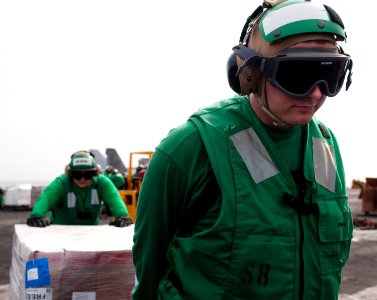US Navy 110408-N-6505H-476 Logistics Specialist Seaman Michael Dilsaver, front, assigned to Strike Fighter Squadron (VFA) 25, and another Sailor mo