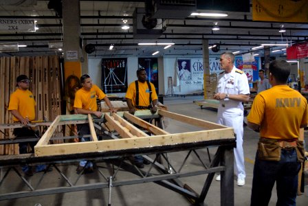 US Navy 110412-N-QE550-011 Rear Adm. Sadler speaks with Sailors from Navy Recruiting District Dallas during a community service event with Habitat