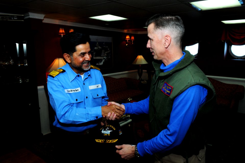 US Navy 110408-N-IC111-934 Capt. Thom Burke, commanding officer of the aircraft carrier USS Ronald Reagan (CVN 76), exchanges a gift with Indian na