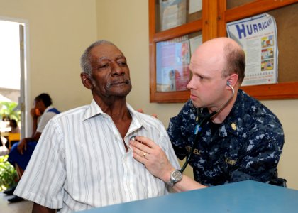 US Navy 110413-N-NY820-065 Lt. Cmdr. Karl Mitchell examines a Jamaican man on the first day of medical screening during Continuing Promise 2011 (CP photo