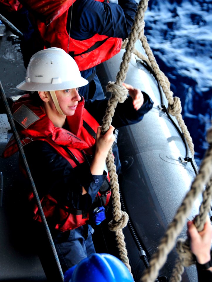 US Navy 110408-N-VL413-022 Lt. j.g. Teri Bolinsky lowers a rigid-hull inflatable boat into the ocean during a training operation