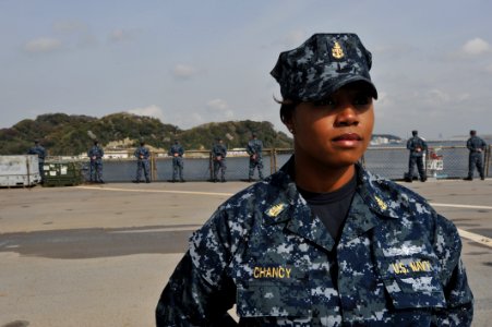 US Navy 110411-N-0864H-046 Senior Chief Information Systems Technician Tangela Chancey mans the rails aboard USS Blue Ridge as it returns from a tw