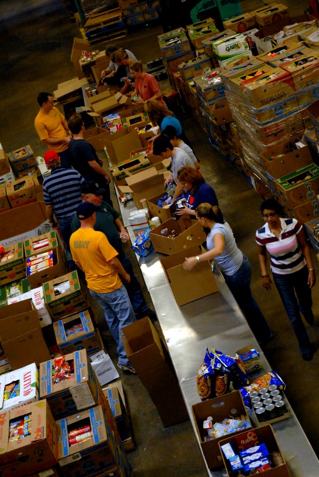 US Navy 110411-N-QE550-010 Sailors assigned to Navy Recruiting District Dallas, help other volunteers sort and package food at the North Texas Food