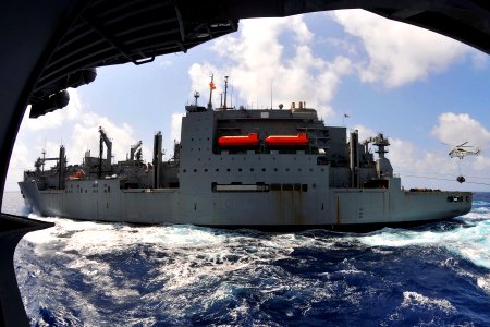 US Navy 110409-N-1004S-737 An SA-330 Puma helicopter lifts a pallet of supplies from USNS Richard E. Byrd (T-AKE 4) during a replenishment at sea